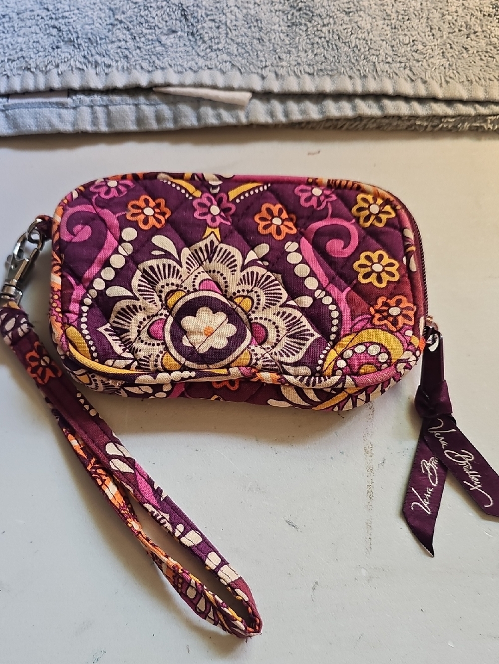 Vera Bradley Retired Safari Sunset Quilted Wristlet. strap and zippered closure.